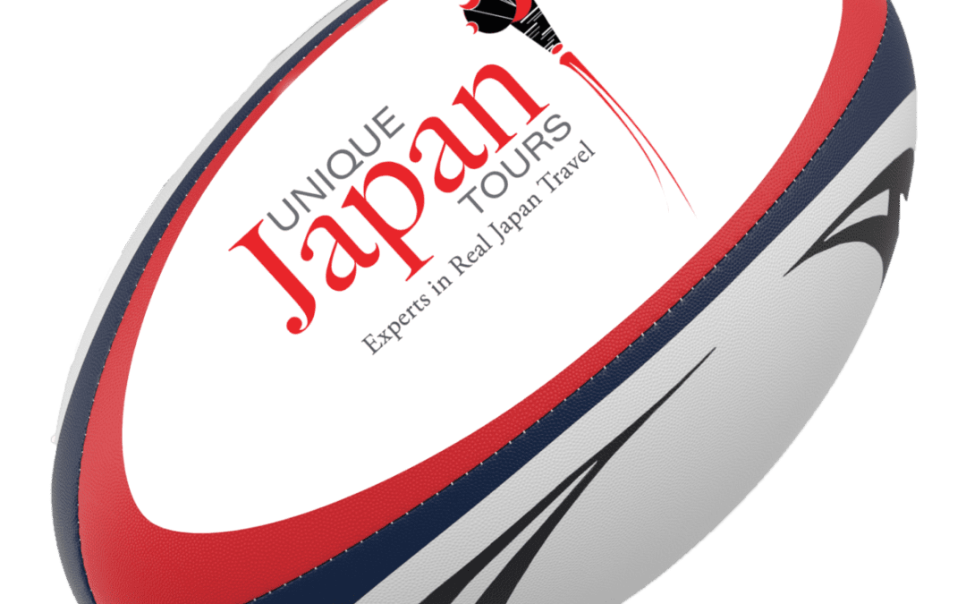 Rugby ball featuring the Unique Japan Tours logo, promoting travel experiences related to Japan's rugby scene
