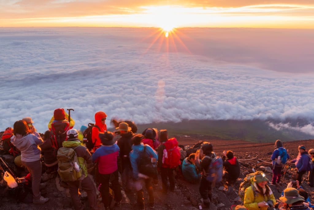 climbers at the summit after climbing Mt Fuji Japan